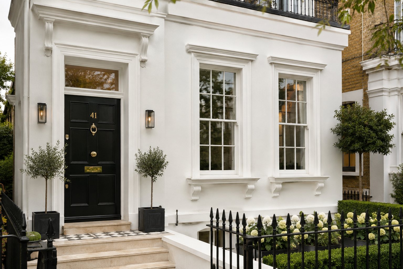 Freshly painted London townhouse exterior with black front door