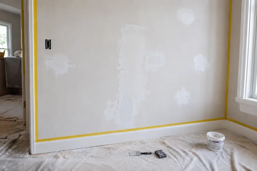 Surface preparation work with masking, filling, and sanding